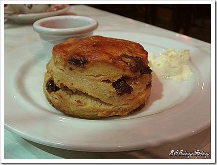 Raisin and Date Scone with Strawberry Jam and Whipped Cream - Side View