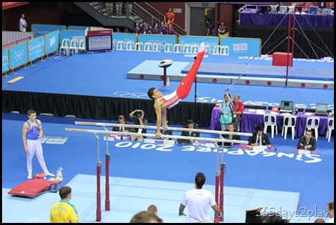 YOG Gym Indiv Apparatus Finals - Sam Oldham looks on