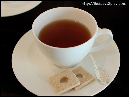 Cup of tea with 2 sugar squares