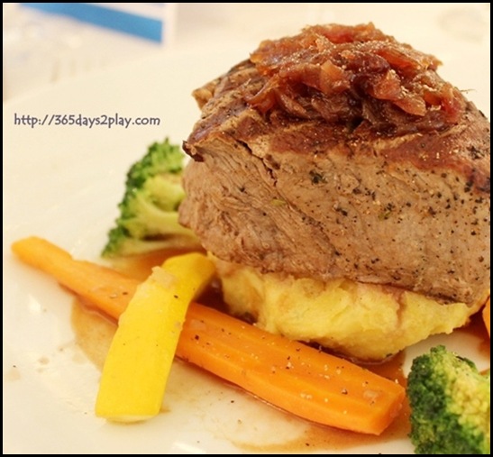 Voyager Carmen Dining Room - Filet of Beef served with potato cake, red onion jam, and shiraz reduction