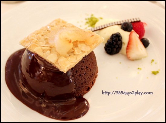 Voyager Carmen Dining Room - Warm Chocolate Cake with a milk chocolate sauce and sliced roasted pears