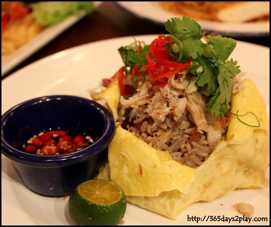 Hard Rock Cafe - Crab Fried Rice, wok fried with succulent crab meat, prawns and diced portobello mushrooms, wrapped in an egg omelette $20   (2)