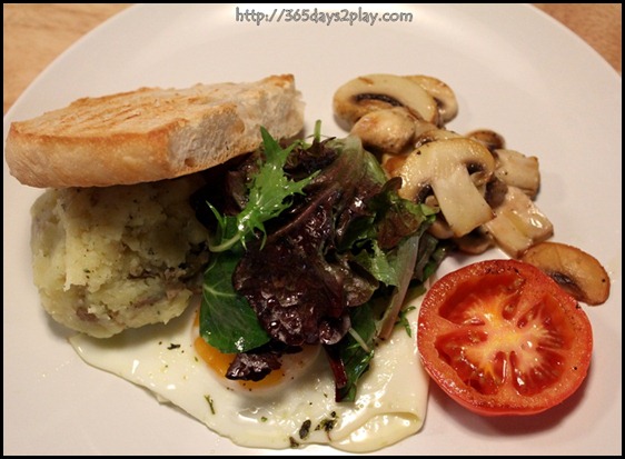 Real Food - Sunny side up with mashed herbed potatoes and sauteed wild mushrooms. served with fresh green salad and sourdough bread $9 (1)