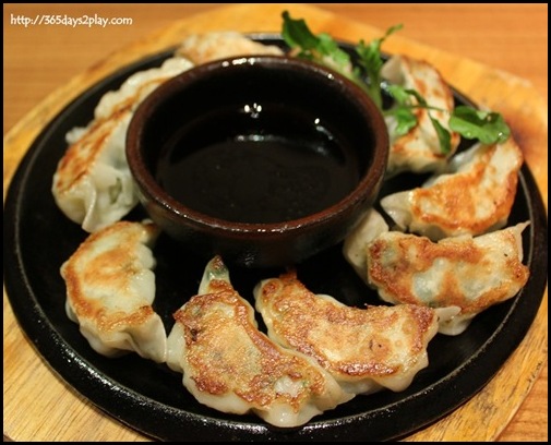 Sun Dining - Fukuoka Kurobuta Gyoza (Pan fried bite-sized Berkshire pork dumplings filled with cabbage, chives and garlic)