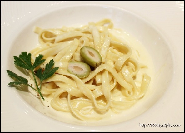 Oso Ristorante - Homemade tagliatelle pasta with light Taleggio cheese fondue and baby peach in white truffle flavour