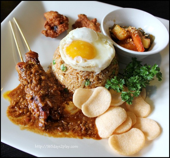 STREET 50 - Crabmeat Istimewa (Stir-fried sambal rice with crabmeat, onion and green peas accompanied by satay, chicken wings, achar, prawn crackers and fried egg) $16