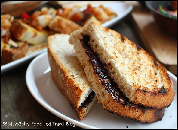 Intrepid Gastro Bar - Vegemite, Mate! — Kalamata olive butter on sourdough toast ($4.90 )