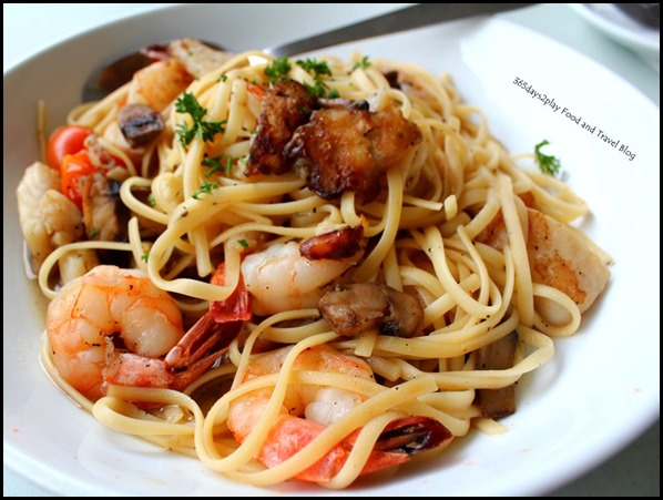 The Garden Slug - Seafood Pasta in white wine sauce with shrimp, fish, mushrooms and cherry tomatoes $17