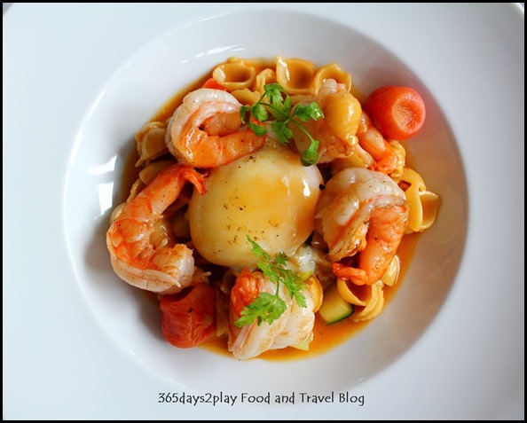 Au Jardin - Prawn a la plancha, egg confit, shell pasta and seasonal vegetables in shellfish glaze (1)