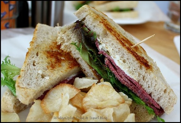 Fabulous Baker Boy - Beef Pastrami Sandwich (beef pastrami topped with caramelised onions mesclun, sriracha on sour dough, casava chips) $14 (2)