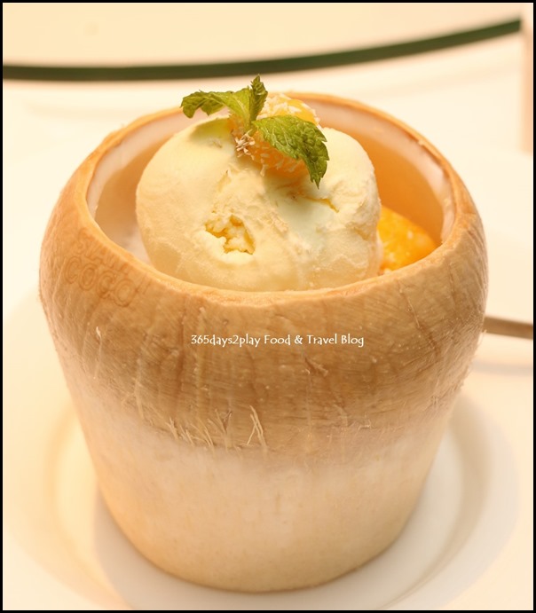 Yan Cantonese Cuisine - Chilled Mango Cream Topped with Vanilla Ice Cream and Oats served in Coconut