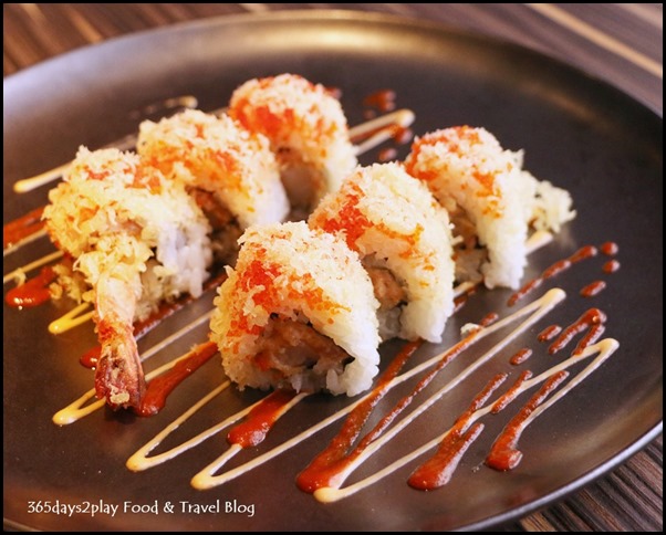 Izy Dining & Bar - Crunch Roll (Tempura shrimp, flying fish roe, avocado & spicy sauce topped with tempura bits) $15