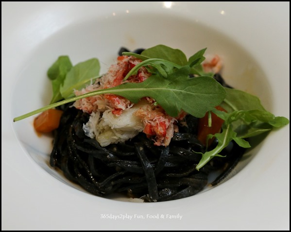 Five Nines -Garlic Flavoured Squid Ink Tagliolini topped with Snow Crab