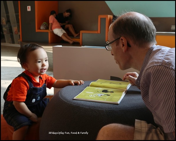 Edward reading books at Pasir Ris Library