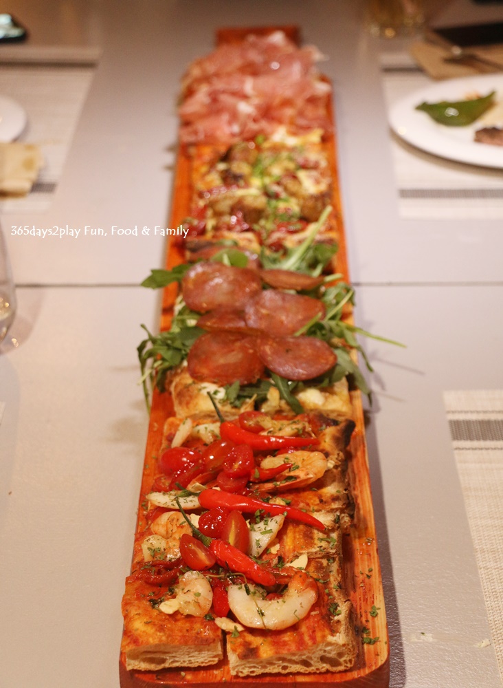 Roots Mediterranean - Parma and Burrata, Salami and Truffle, Prawn Arrabbiata, Sausage Pizza (25cm $18, 50cm $26, 1 metre S$50)